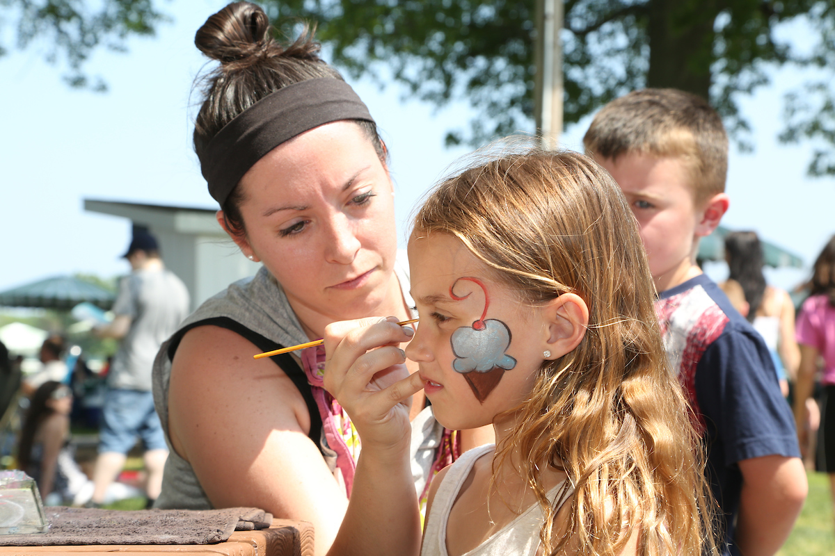 girl getting face painted